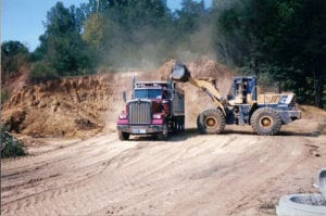Track Loaders clearing the land
